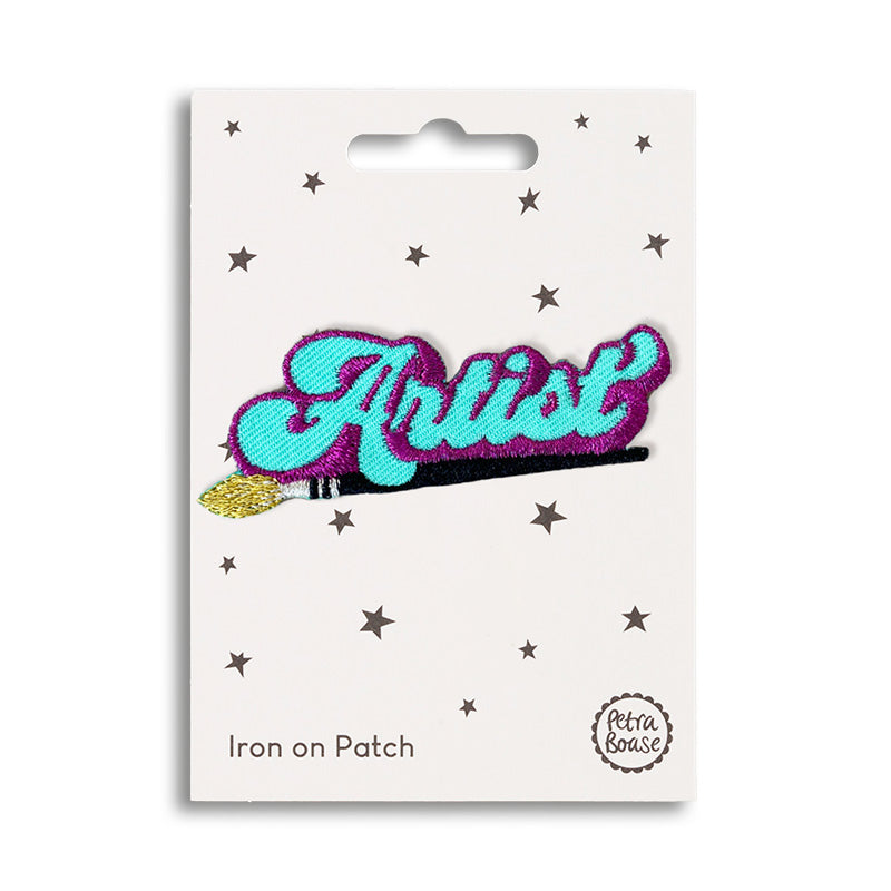 Iron on patch with the word 'artist' on top of a paintbrush.