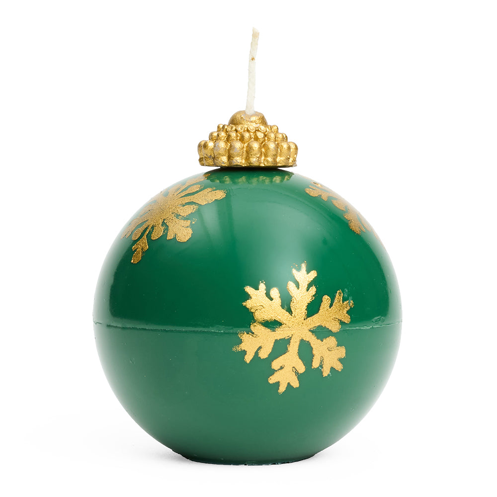 A 3d round bauble shaped candle in green with gold snowflake design and gold top with wick.