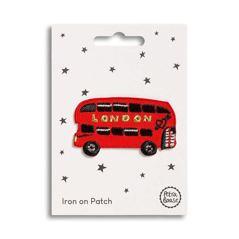 An iron on patch featuring a classic london red bus.