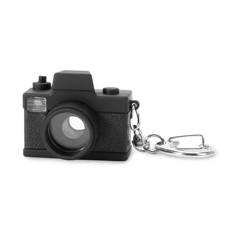 Miniature vintage style black camera on a silver colour keychain.