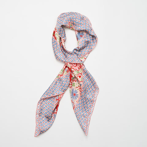 Celia Birtwell styled scarf with a blue and red floral pattern.