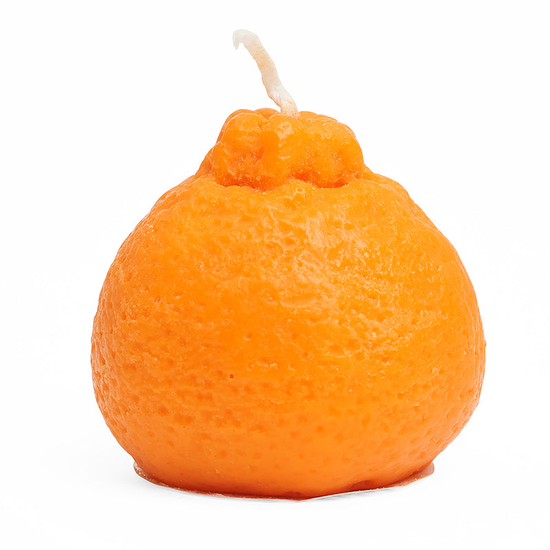 Small, orange, clementine shaped, candle.