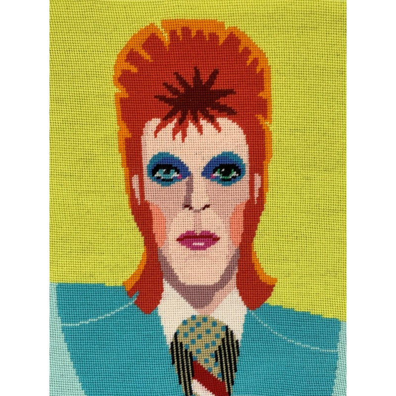 Colourful needlepoint tapestry of david bowie.