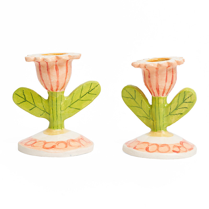 A pair of 3d tulip shaped ceramic candlestick holders with stem centre.