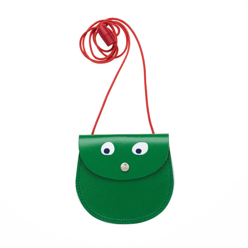 Green pocket purse with red strap featuring printed googly eye design .