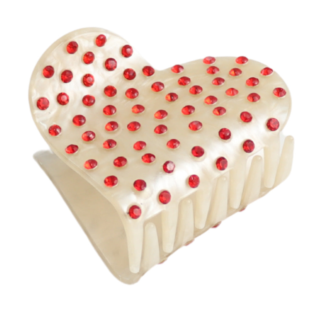 Heart shaped hair claw clip with red crystal embellishments on a white background