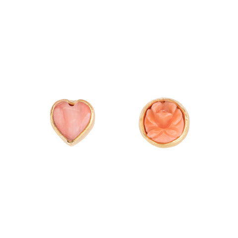 Two different stud earrings featuring a rose and a heart with a gold border. 
