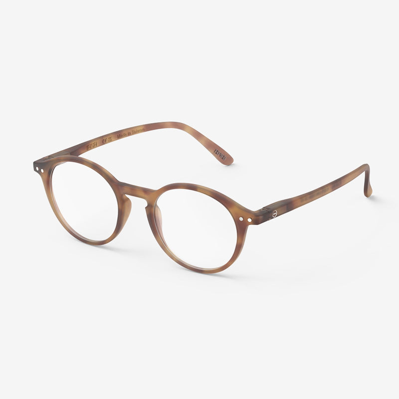 A pair of light brown tortoiseshell reading glasses.