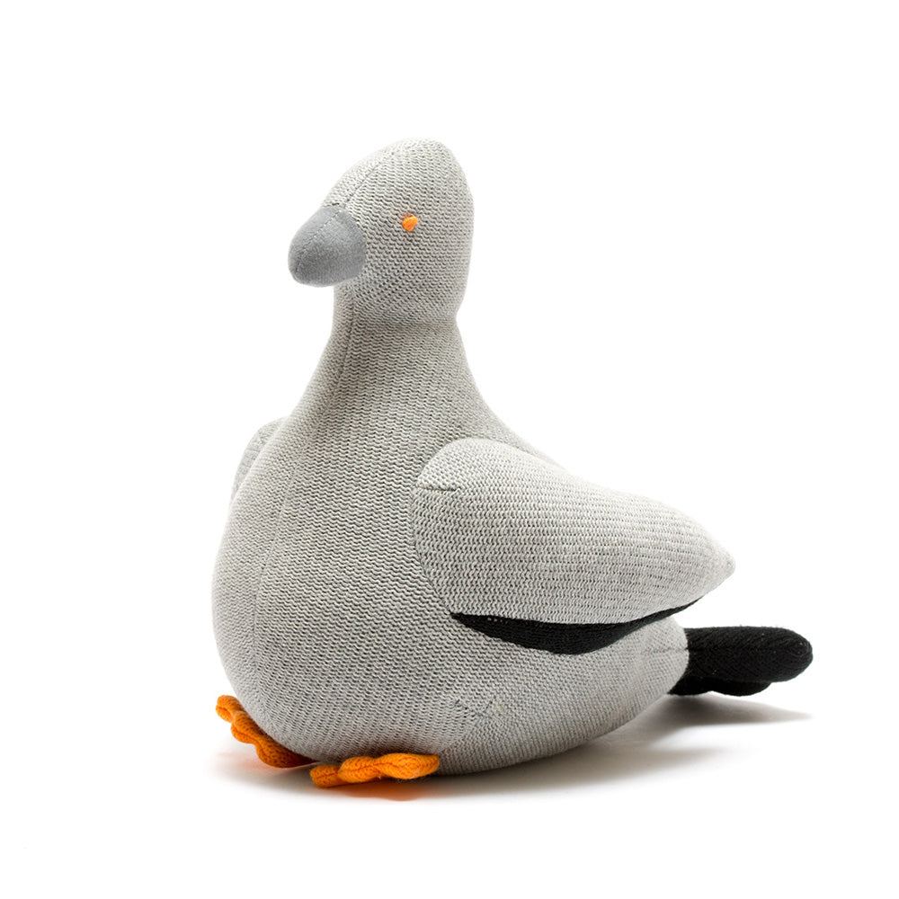 Grey knitted pigeon rattle toy against a white background