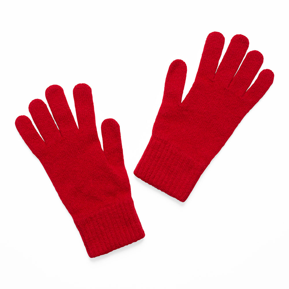 Pair of knitted red gloves on a white background
