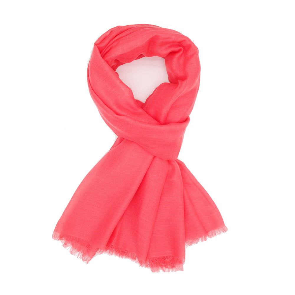 Coral coloured scarf on a white background