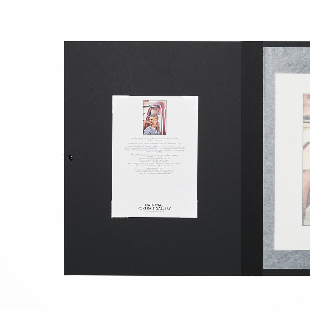 Open folio with black cover and certificate of authenticity.
