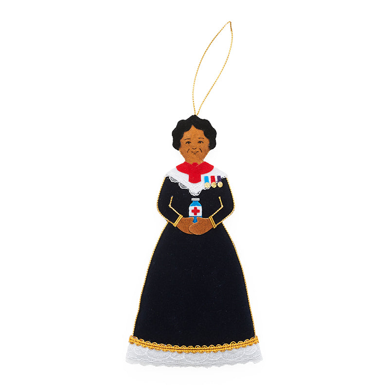 A fabric decoration of mary seacole in a black nurses dress.
