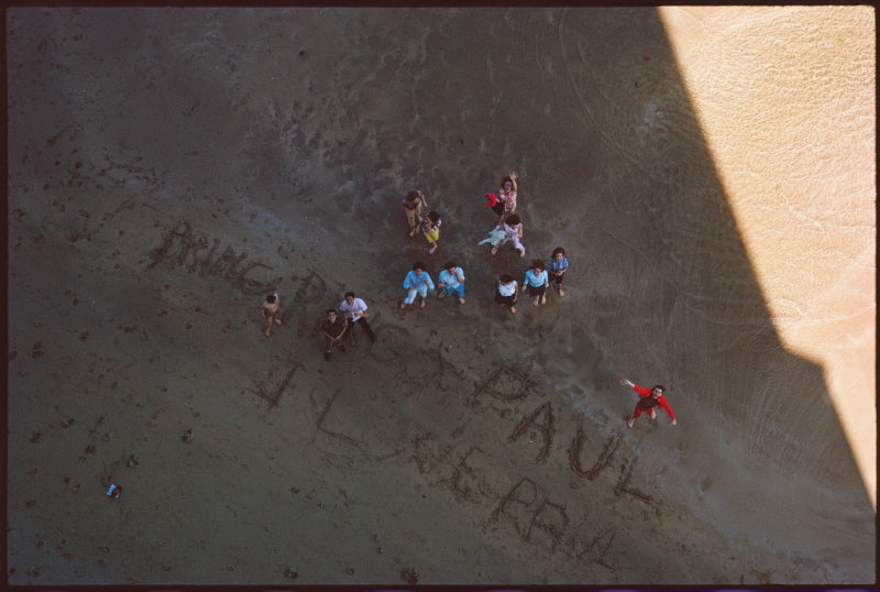 Photograph of the beatles names written in the sand taken by paul mccartney.