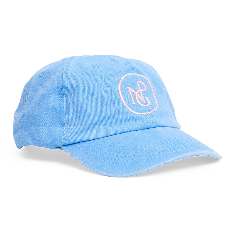 A bright blue baseball hat with a baby pink npg logo on the front.