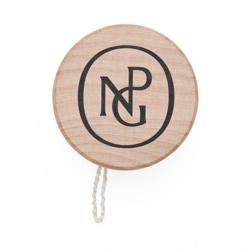 A solid wood yoyo printed with the national portrait gallery monogram in black.