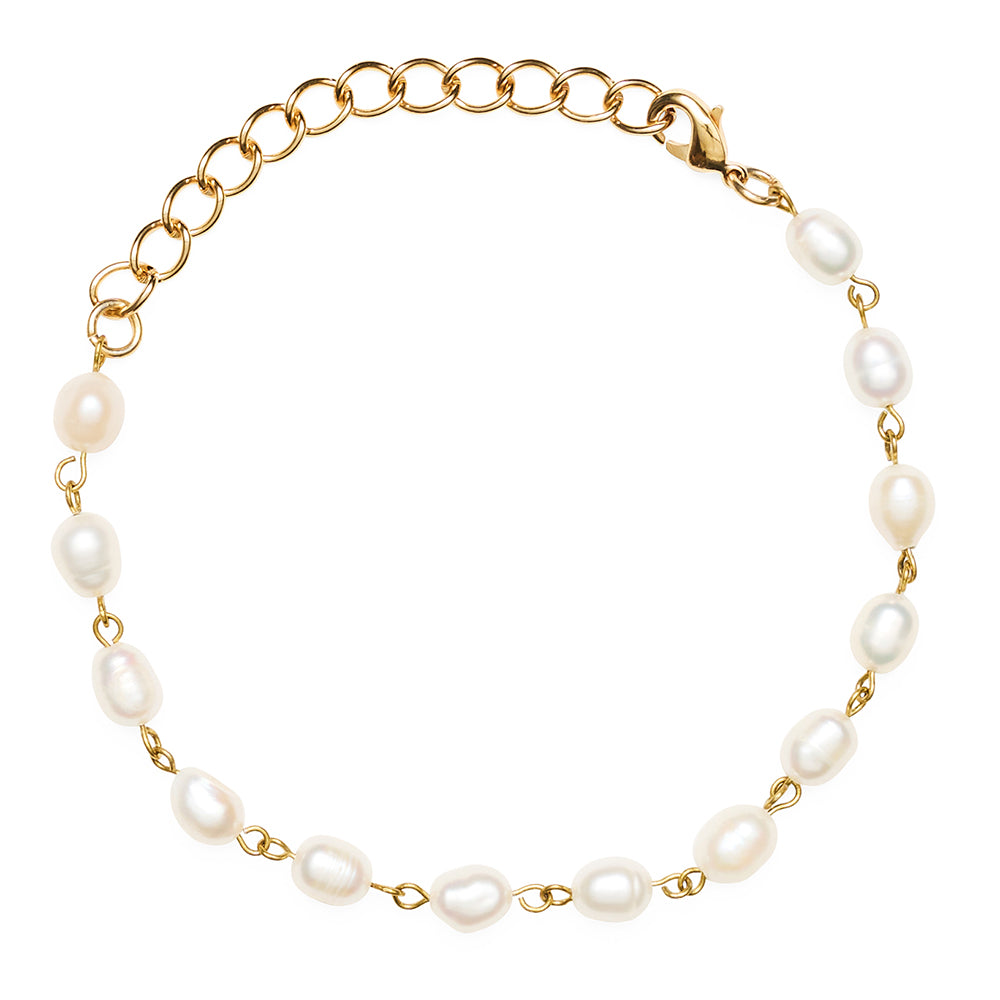 Gold bracelet with pearls on a white background