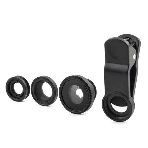 A set of four black camera phone lenses in a row.