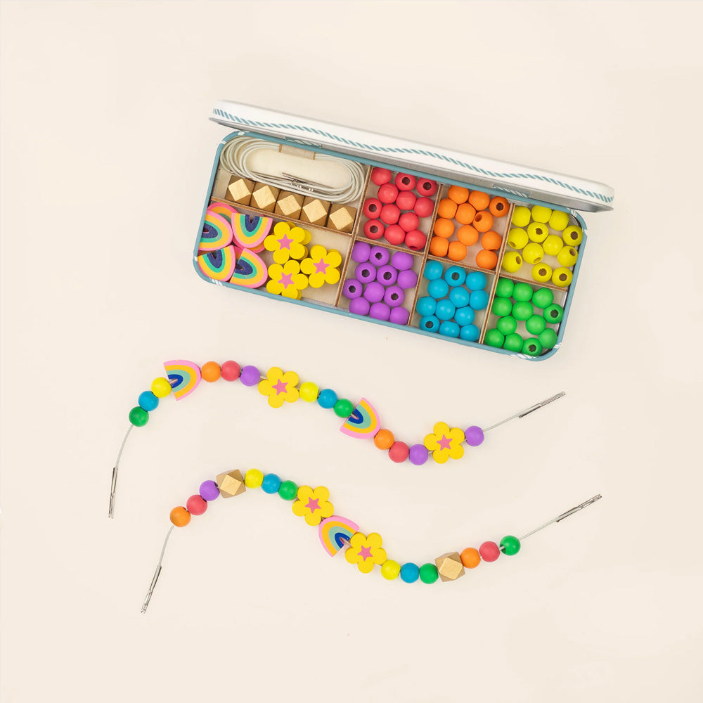 Colourful bead set with a partially completed bracelet on a beige background