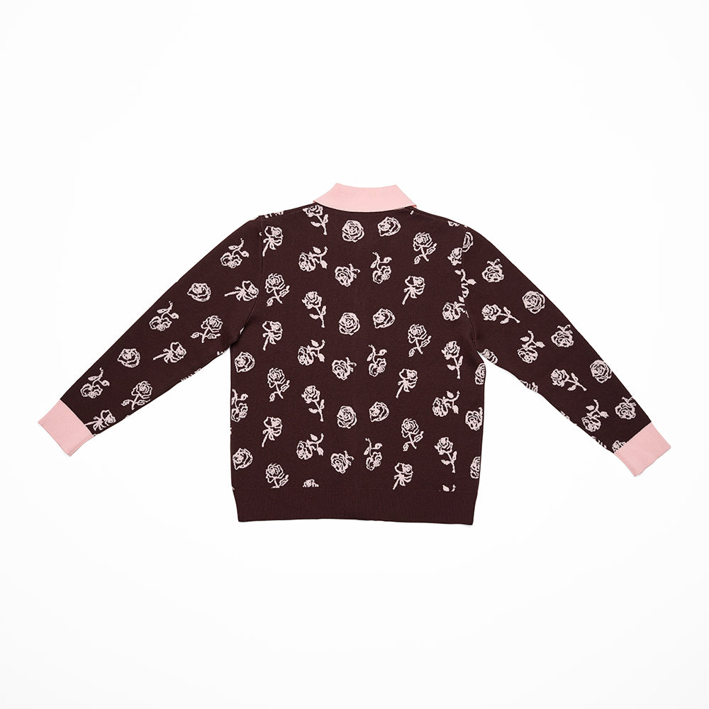 Reverse of brown cardigan with pink floral pattern and collar on a white background