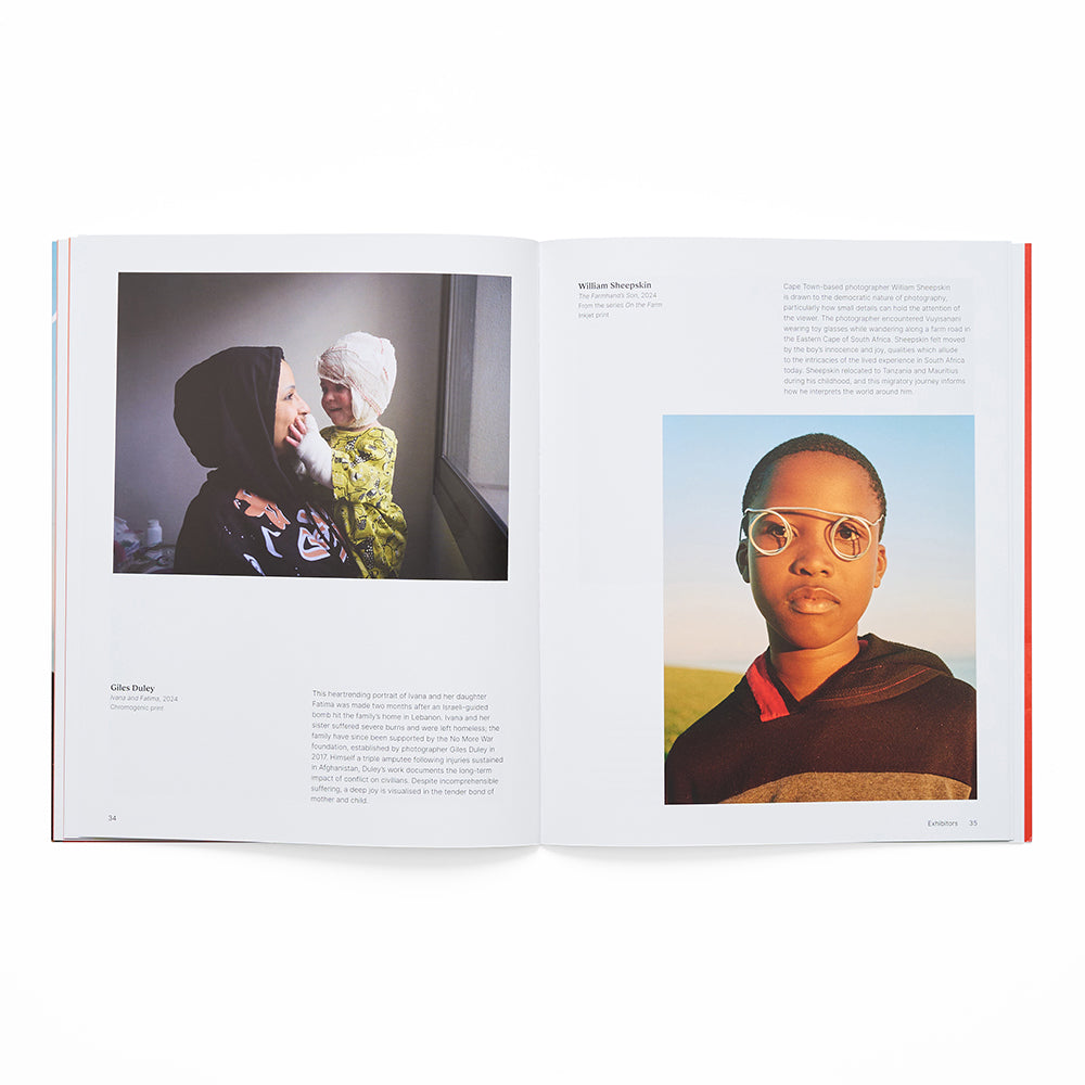 Open book showing two photographs of people, one with a child and another of a young person wearing glasses.