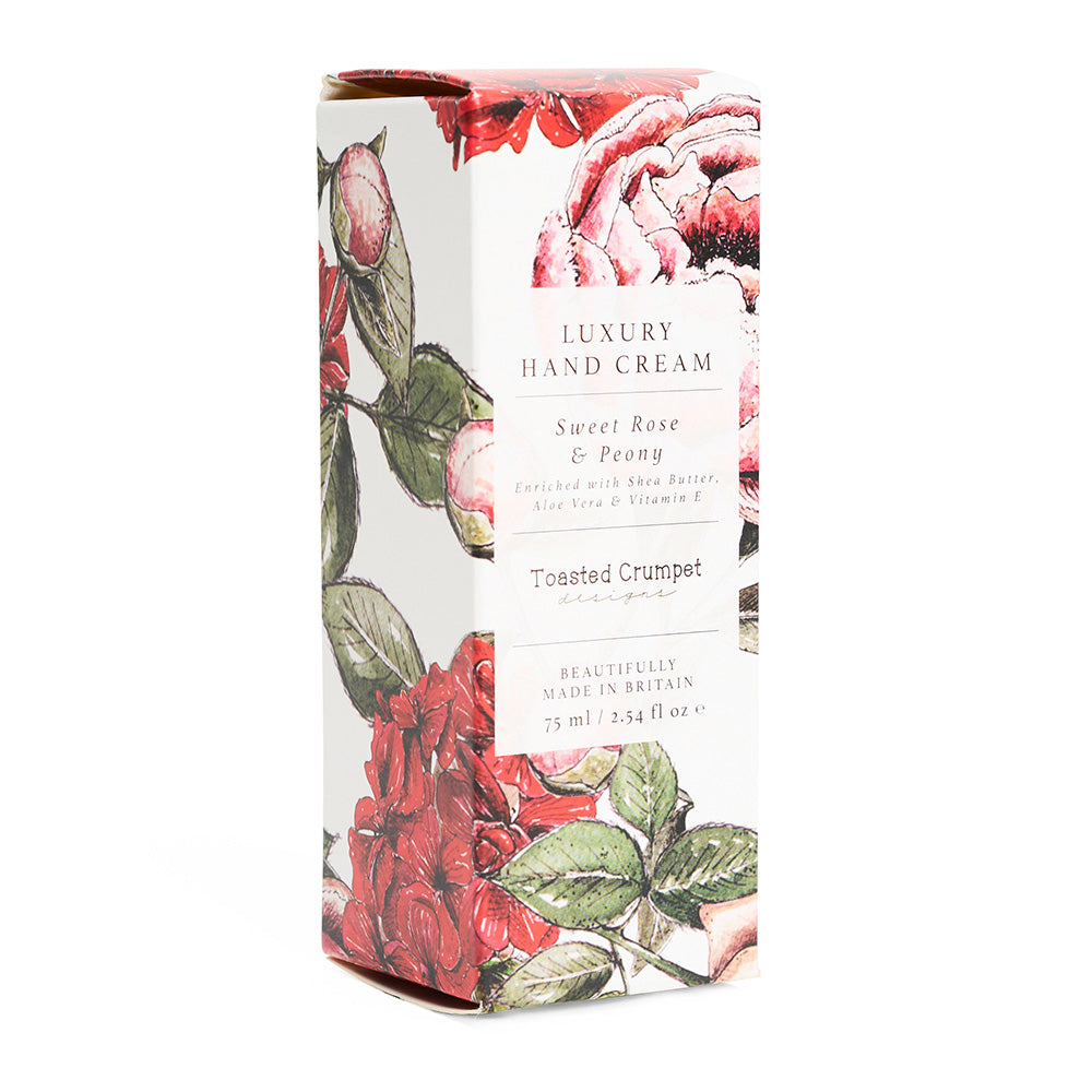 Luxury hand cream packaging with floral design on a white background