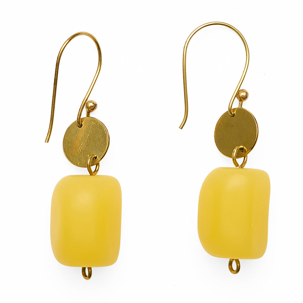 Yellow charm earrings with gold hooks on a white background