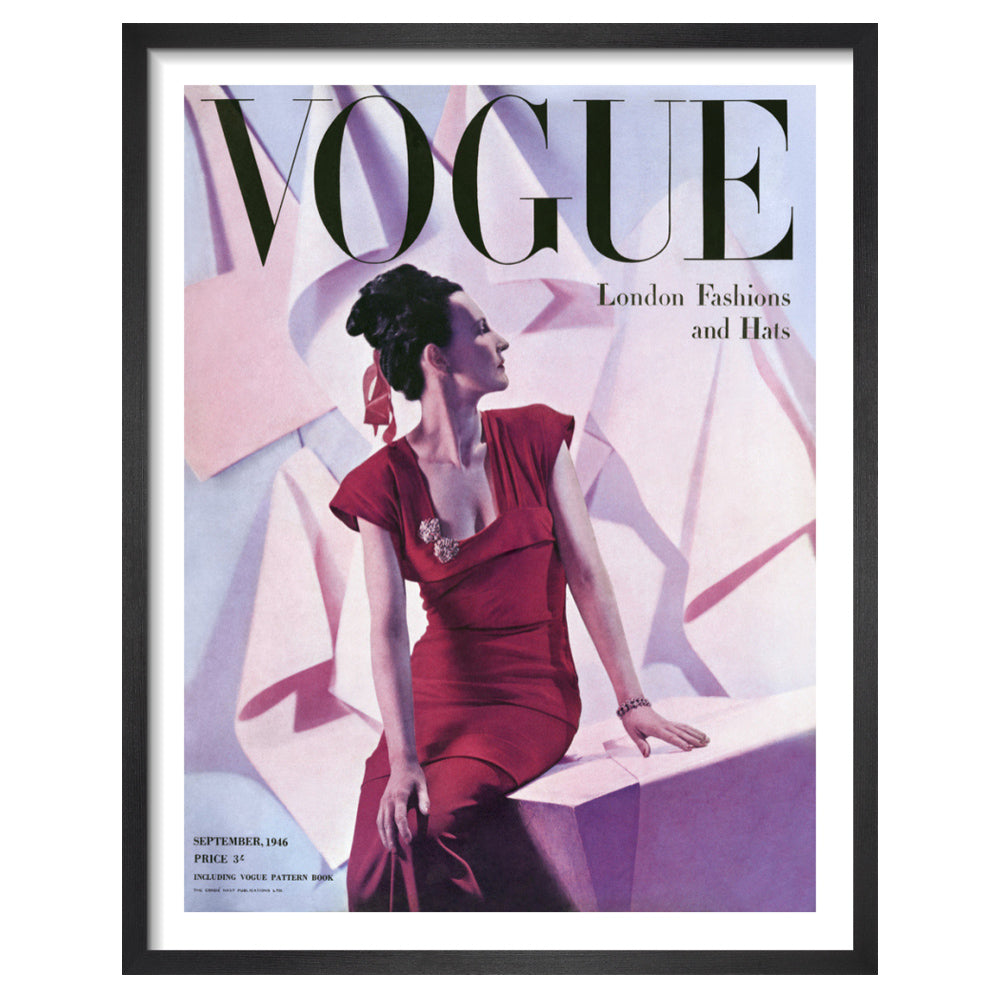 Vintage vogue magazine cover with a woman in a red dress against a colorful abstract background