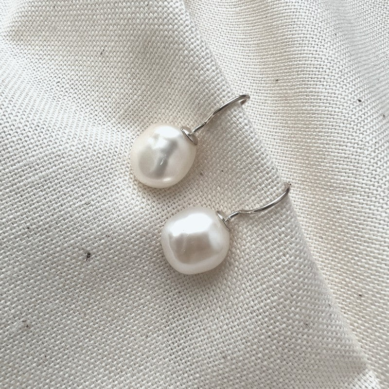 Baroque pearl drop earrings inspired by jewellery worn by queen elizabeth ii for her platinum jubilee collection at the national portrait gallery