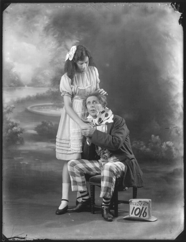 Phyllis griffiths as alice; charles hayden coffin as the mad hatter in 'alice in wonderland' at the garrick theatre npg x121240