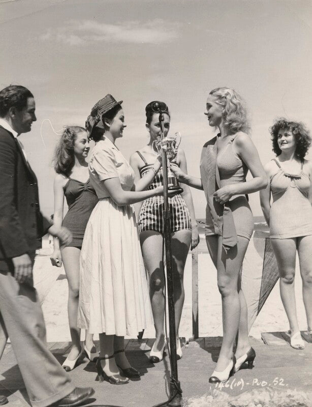 Jean simmons presenting a trophy to the winner of a bathing beauty competition npg x198391