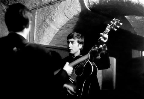 Black and white photograph of John Lennon and Paul McCartney by Michael Ward. 1963.