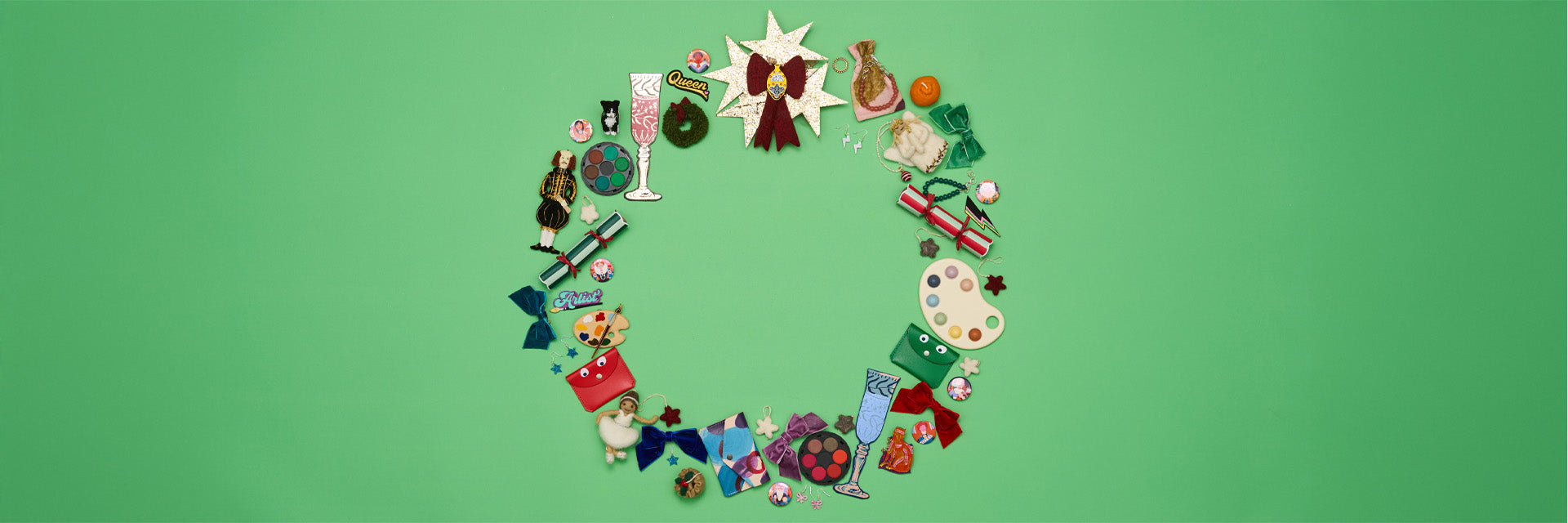 A series of small gifts appear to burst out of a colourful fabric christmas stocking.