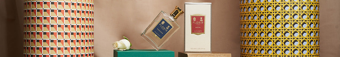 A florence perfume bottle balances against the box packaging.
