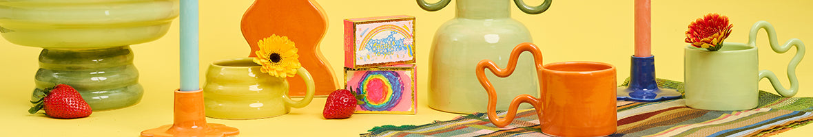 Spring edit scene featuring a flower press, pastel eggs and floral jewellery