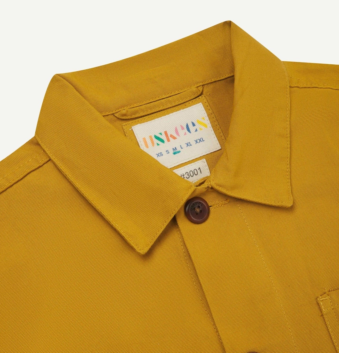 Close up detail of overshirt collar and button