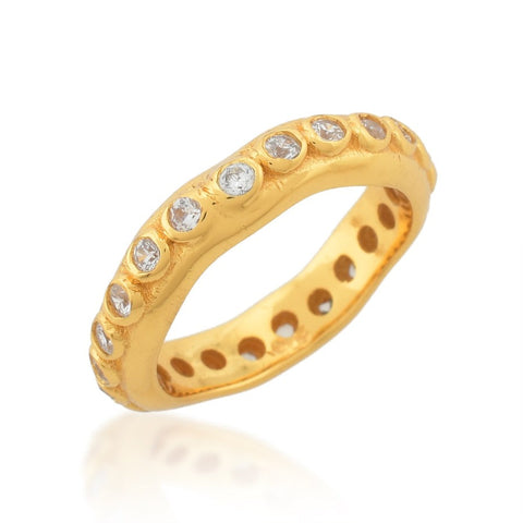 A textured gold band ring with inset clear crystals on the outer rim.