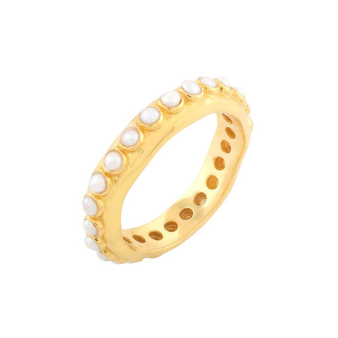 A textured gold band ring with inset small pearls on the outer rim.