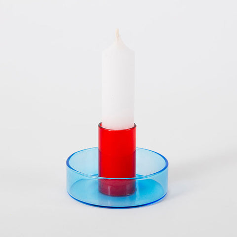 Glass candle holder with blue base and red centre.
