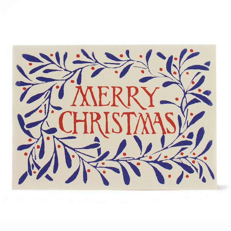 An image of a christmas card featuring a wreath design and a 'merry christmas' message in coral and ultramarine blue