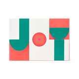 cut out graphic card saying 'joy' in red, green and white