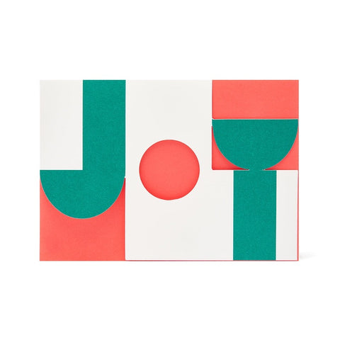 cut out graphic card saying 'joy' in red, green and white