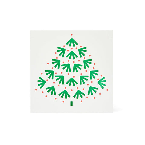 A cut out tree card with a green inside