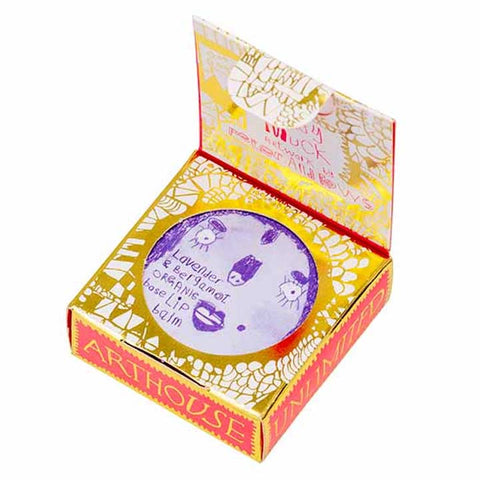 Purple lip balm case in a gold and red detailed packaging.
