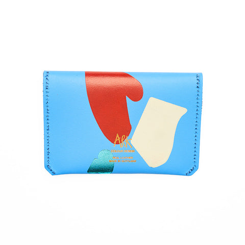 Reverse of rectangular blue leather purse with paint splatter abstract pattern.