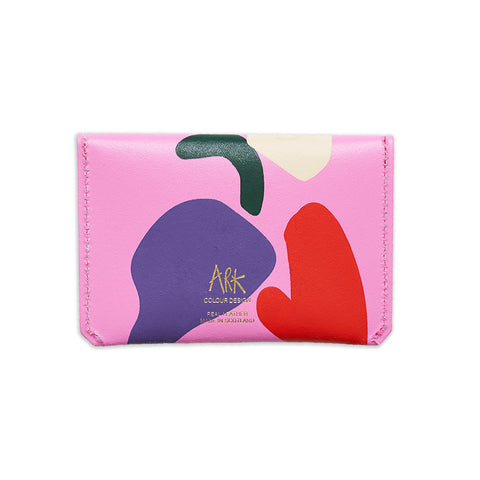 back of rectangular leather hot pink purse with colourful abstract designs and gold Ark logo. 