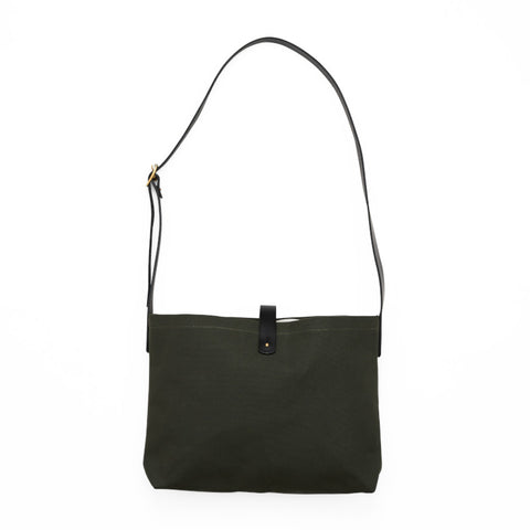 Rectangular dark green canvas bag with an adjustable strap.