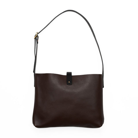 Rectangular dark brown leather bag with an adjustable strap. 