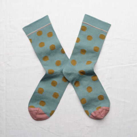 Arctic blue socks with khaki polka dots and light pink toes.