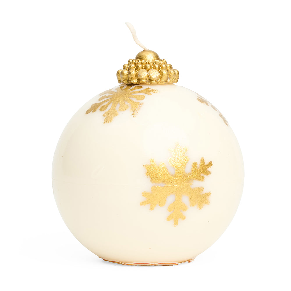 A 3d round bauble shaped candle in white with gold snowflake pattern with gold top and wick. 